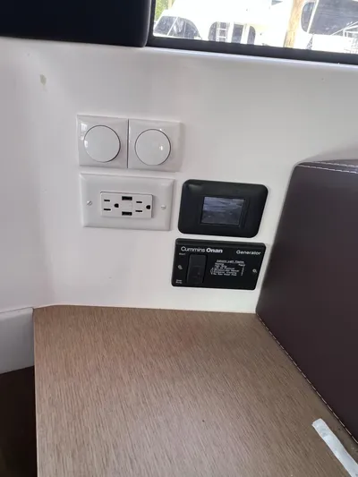 Tri It Yacht Photos Pics Control panel and outlets on NEEL 51, 2018 model, featuring Cummins Onan generator.