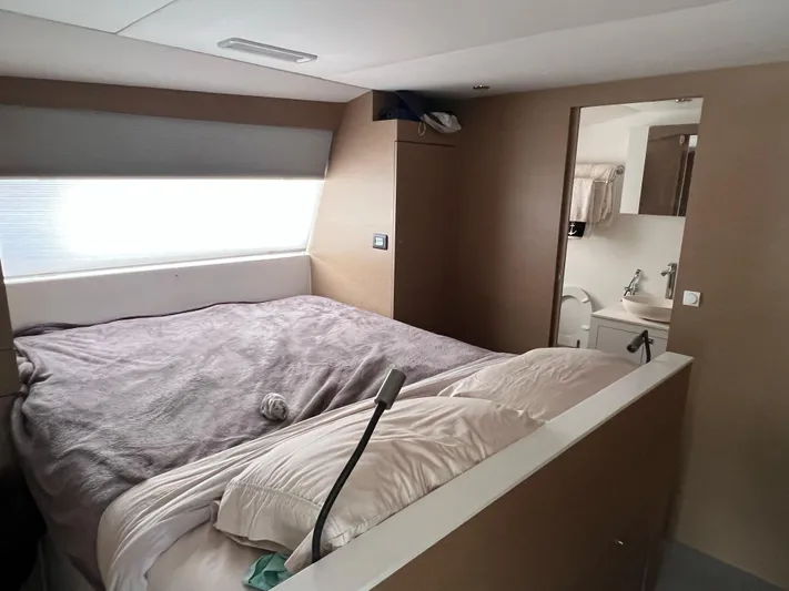 Tri It Yacht Photos Pics Interior of 2018 NEEL 51 yacht featuring a cozy bedroom and ensuite bathroom.