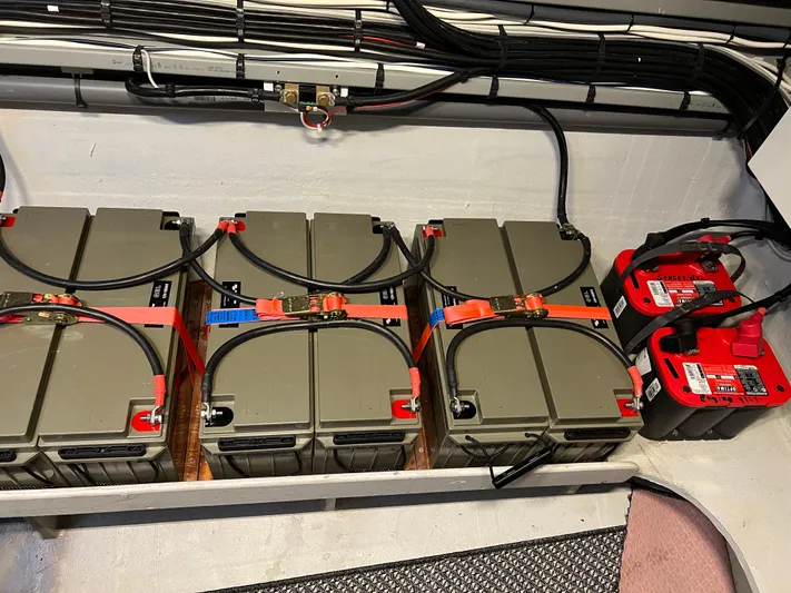 Tri It Yacht Photos Pics Battery compartment of a 2018 NEEL 51, featuring multiple connected batteries.