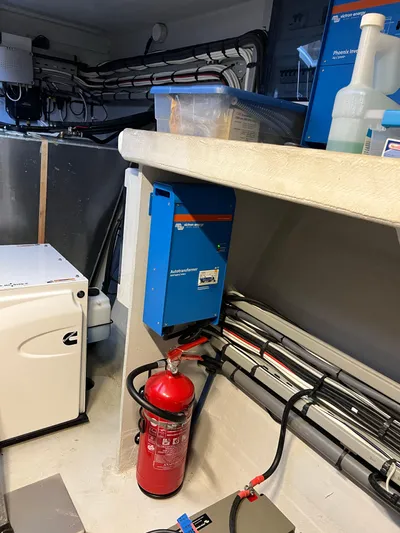 Tri It Yacht Photos Pics Interior of a 2018 NEEL 51 boat with fire extinguisher and electrical equipment.