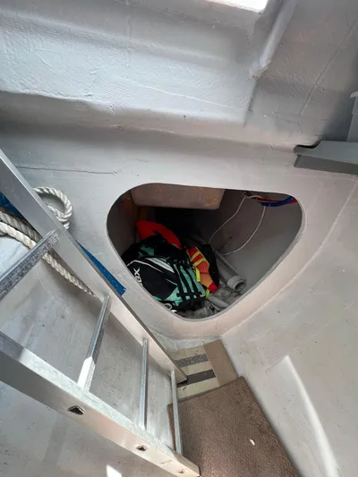 Tri It Yacht Photos Pics Interior of a 2018 NEEL 51 boat with storage compartment and ladder.