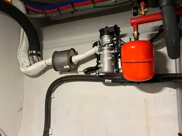 Tri It Yacht Photos Pics Engine compartment of a 2018 NEEL 51 with visible pipes and components.