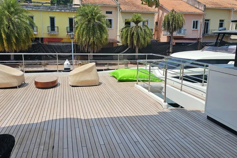  Yacht Photos Pics Luxurious deck of 2022 Azimut Grande 32 Metri yacht with modern seating and palm trees.