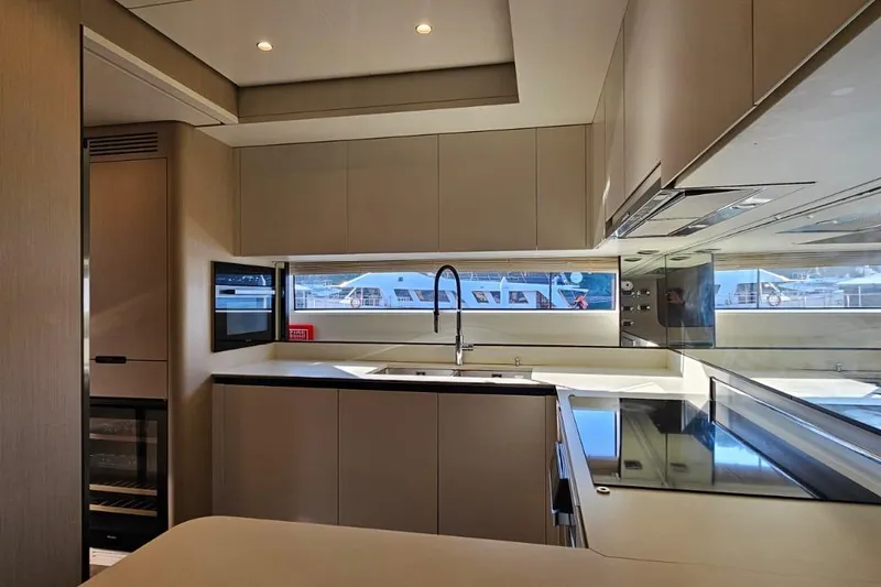  Yacht Photos Pics Luxurious kitchen interior of 2022 Azimut Grande 32 Metri yacht, featuring modern design and appliances.