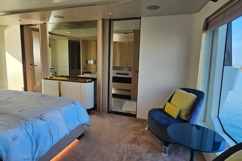  Yacht Photos Pics Luxurious bedroom interior of 2022 Azimut Grande 32 Metri yacht with ocean view.