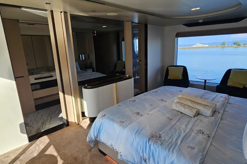  Yacht Photos Pics Luxurious bedroom interior of 2022 Azimut Grande 32 Metri yacht with ocean view.