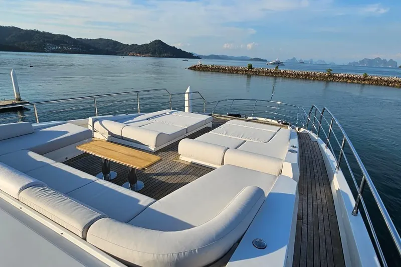  Yacht Photos Pics Luxurious 2022 Azimut Grande 32 Metri yacht deck with elegant seating and scenic ocean view.