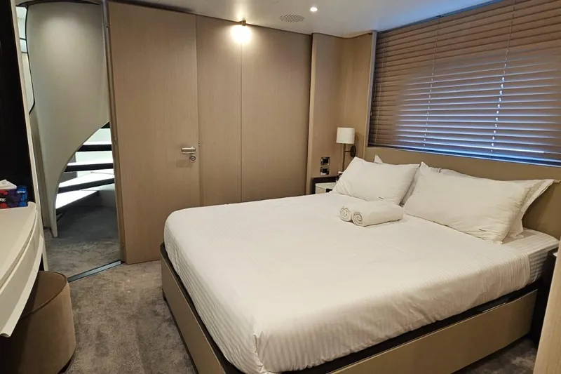  Yacht Photos Pics Luxurious bedroom interior on 2022 Azimut Grande 32 Metri yacht, featuring modern design and comfort.