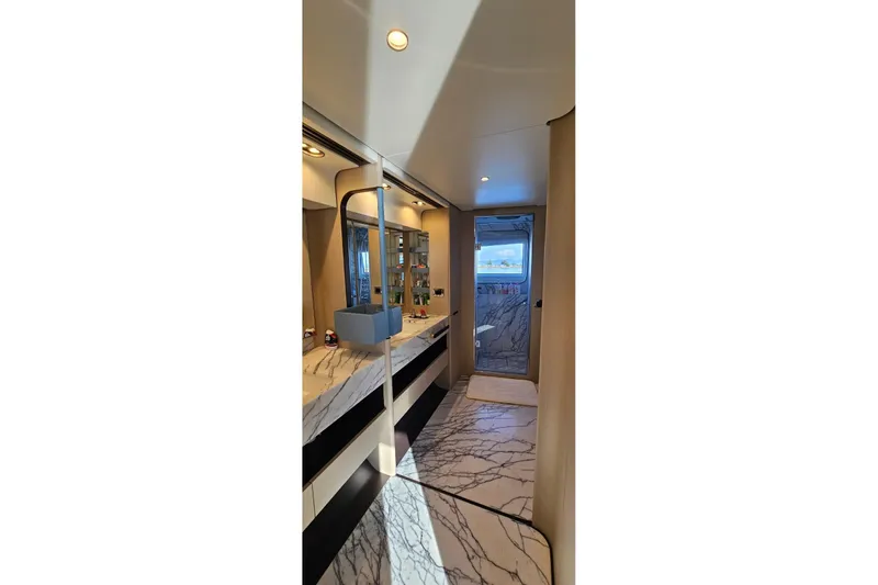 Yacht Photos Pics Luxurious bathroom interior of 2022 Azimut Grande 32 Metri yacht with marble finishes.