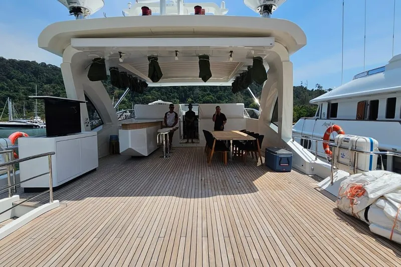  Yacht Photos Pics Luxurious deck of 2022 Azimut Grande 32 Metri yacht, featuring elegant outdoor seating.