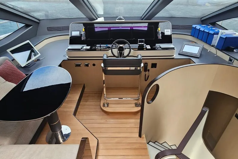  Yacht Photos Pics Luxurious helm of 2022 Azimut Grande 32 Metri yacht with modern controls and seating.