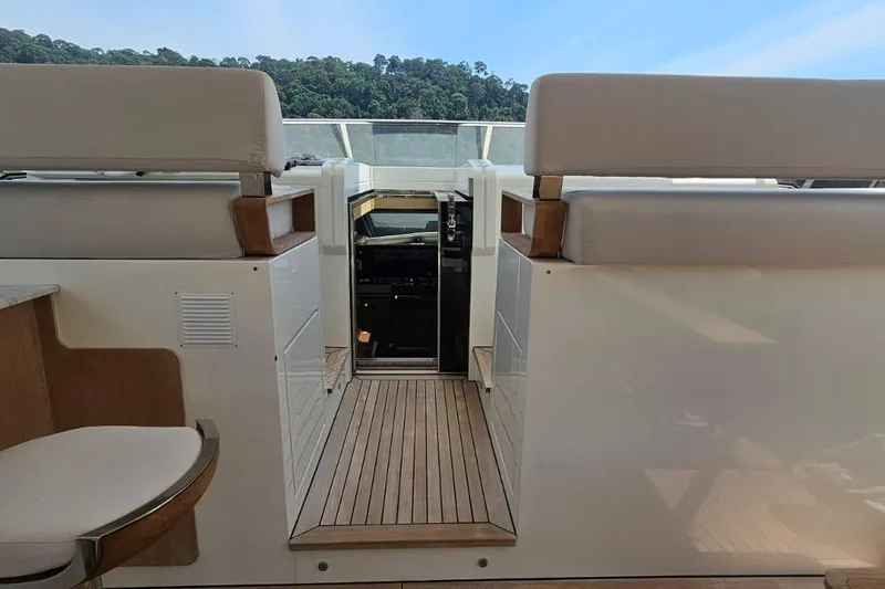 Yacht Photos Pics Azimut Grande 32 Metri yacht interior, featuring elegant seating and wooden flooring, 2022 model.