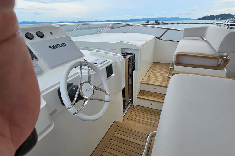  Yacht Photos Pics Helm of 2022 Azimut Grande 32 Metri yacht with Simrad navigation system.