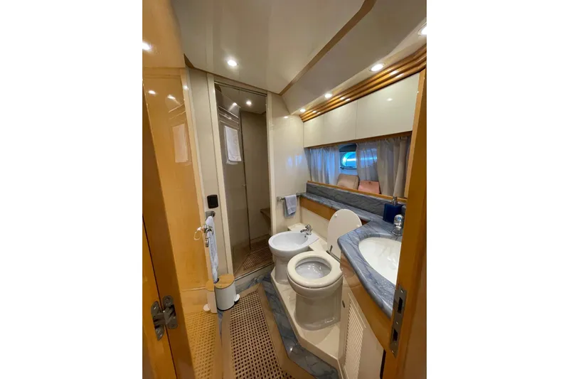  Yacht Photos Pics Luxurious bathroom in 2003 Cantieri di Sarnico 65 HT yacht, featuring modern amenities.