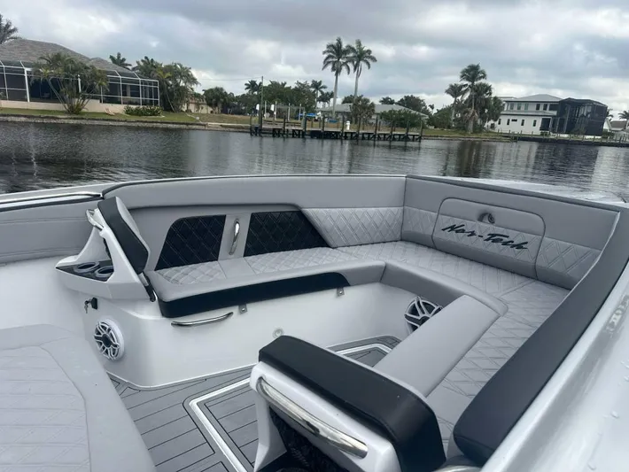  Yacht Photos Pics Luxurious seating on 2025 Nor-Tech 400SS boat with waterfront view.