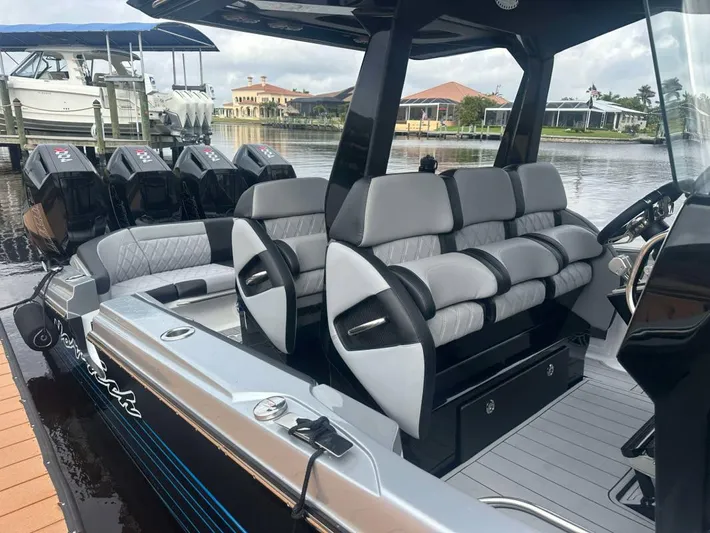  Yacht Photos Pics 2025 Nor-Tech 400SS boat interior with luxurious seating and multiple outboard engines.