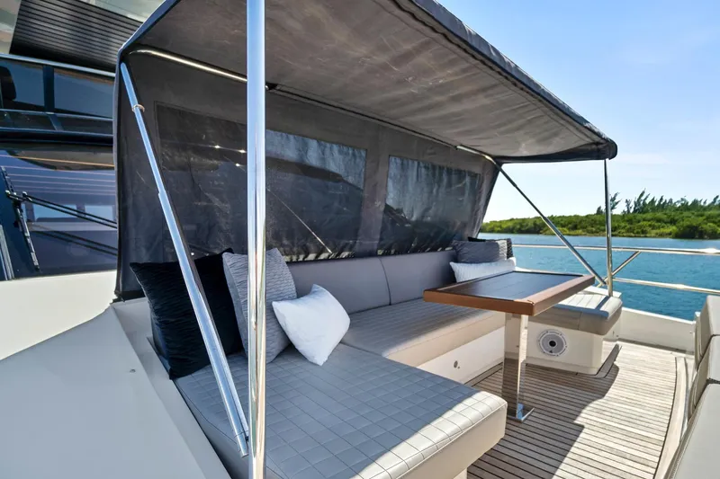 Smile Yacht Photos Pics Astondoa 66 Flybridge 2023 yacht with shaded seating area and ocean view.