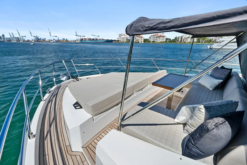 Smile Yacht Photos Pics Luxurious 2023 Astondoa 66 Flybridge yacht with spacious deck and elegant seating area.