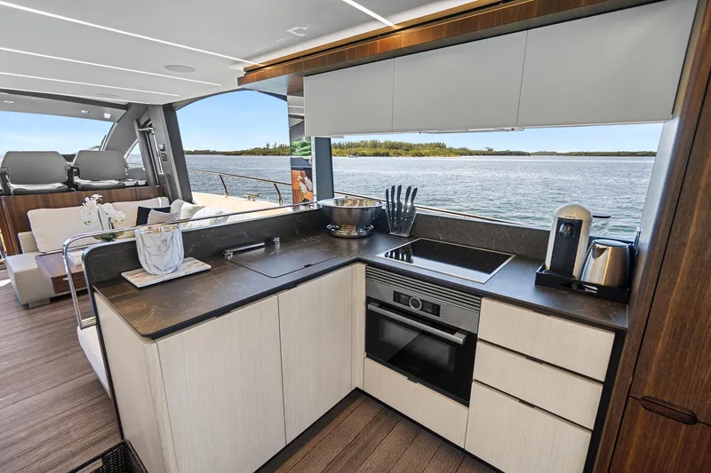 Smile Yacht Photos Pics Luxurious kitchen interior of 2023 Astondoa 66 Flybridge yacht with scenic water view.