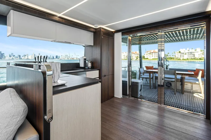 Smile Yacht Photos Pics Luxurious interior of 2023 Astondoa 66 Flybridge yacht with modern kitchen and scenic views.