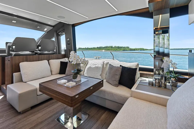 Smile Yacht Photos Pics Luxurious interior of 2023 Astondoa 66 Flybridge yacht with elegant seating and scenic ocean view.
