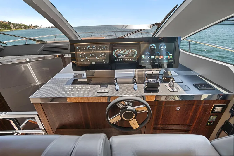 Smile Yacht Photos Pics Luxurious 2023 Astondoa 66 Flybridge yacht helm with modern controls and ocean view.