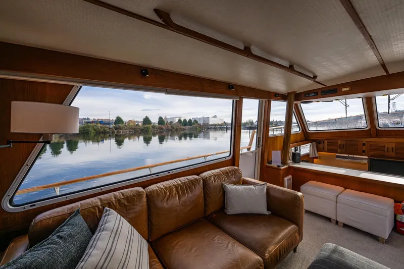 Holiday Yacht Photos Pics Luxurious interior of 1991 Tollycraft 48 Cockpit Motor Yacht with scenic water view.