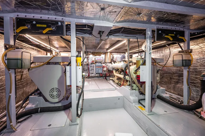 Holiday Yacht Photos Pics Engine room of 1991 Tollycraft 48 Cockpit Motor Yacht, showcasing mechanical components.