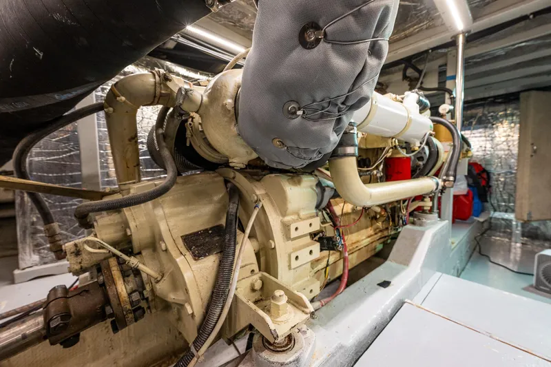 Holiday Yacht Photos Pics Engine room of 1991 Tollycraft 48 Cockpit Motor Yacht, showcasing detailed machinery.