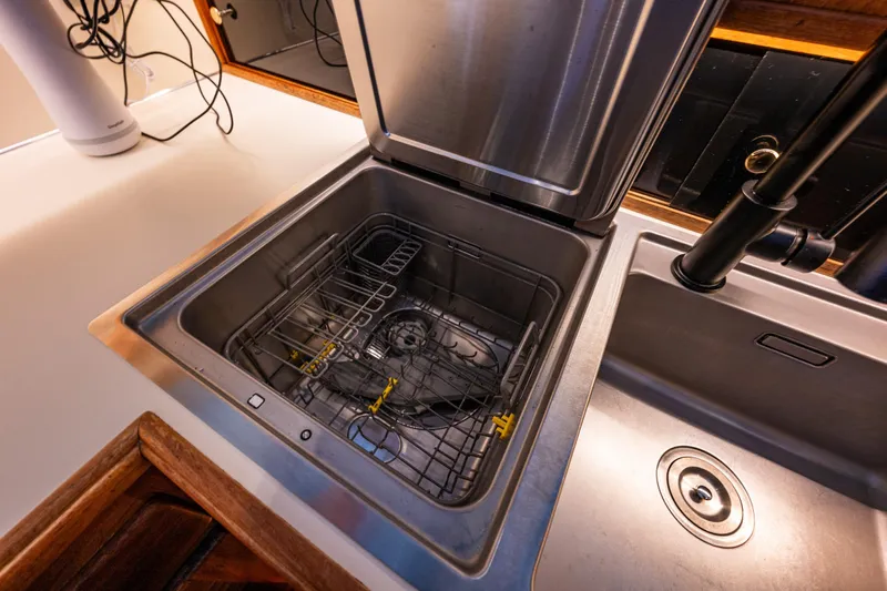 Holiday Yacht Photos Pics Built-in dishwasher and sink on 1991 Tollycraft 48 Cockpit Motor Yacht kitchen counter.