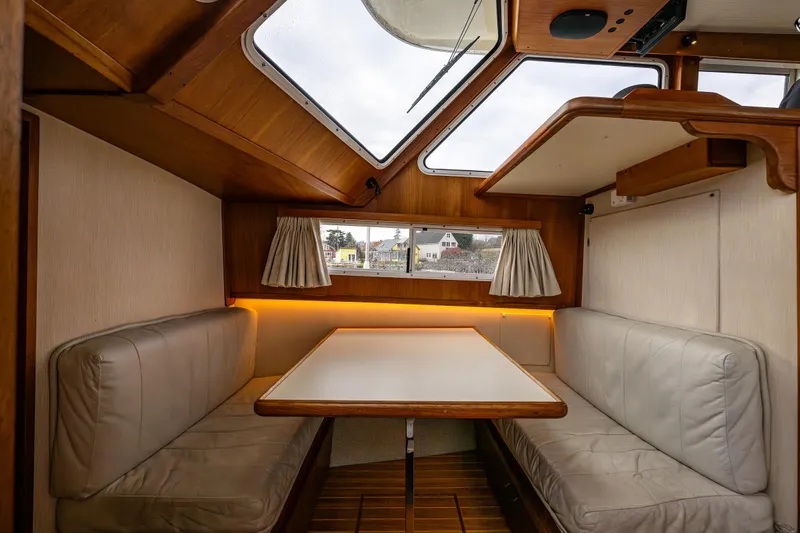 Holiday Yacht Photos Pics Interior of 1991 Tollycraft 48 Cockpit Motor Yacht with cozy dining area.