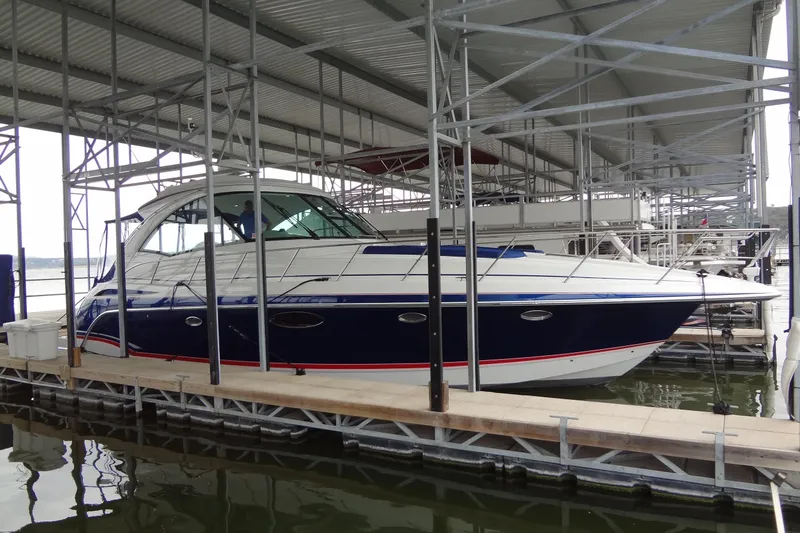 Dream Catcher Yacht Photos Pics 2010 Formula 45 Yacht docked under a metal canopy.