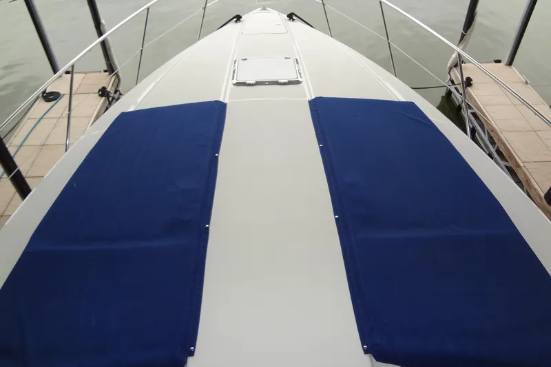 Dream Catcher Yacht Photos Pics 2010 Formula 45 Yacht deck with blue sun pads, docked at marina.