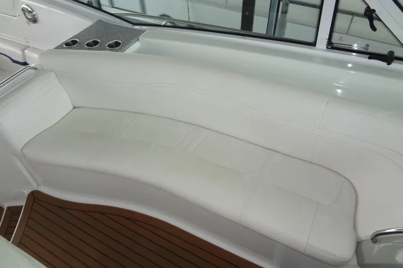 Dream Catcher Yacht Photos Pics Luxurious white seating on 2010 Formula 45 Yacht with wooden flooring and cup holders.