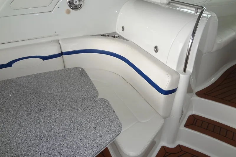 Dream Catcher Yacht Photos Pics Interior seating and table on a 2010 Formula 45 Yacht, featuring white and blue upholstery.