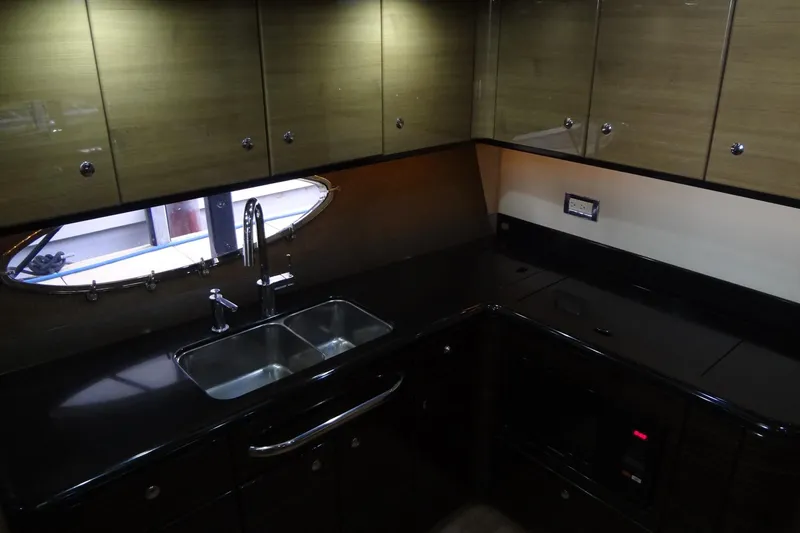 Dream Catcher Yacht Photos Pics Luxurious kitchen interior of 2010 Formula 45 Yacht with sleek cabinetry and modern fixtures.