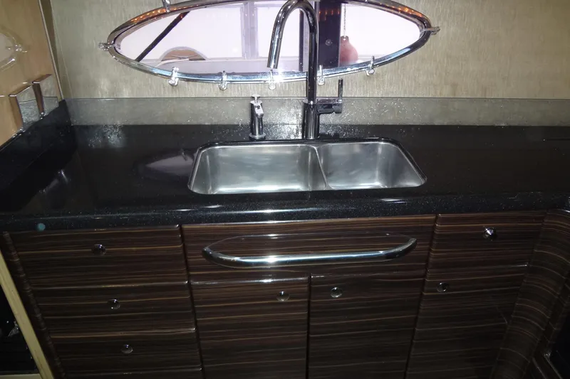 Dream Catcher Yacht Photos Pics Luxury kitchen sink in 2010 Formula 45 Yacht with sleek cabinetry and modern fixtures.