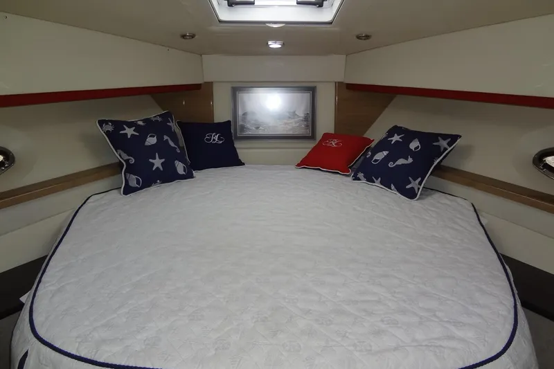 Dream Catcher Yacht Photos Pics Cozy bedroom interior of 2010 Formula 45 Yacht with nautical-themed pillows.