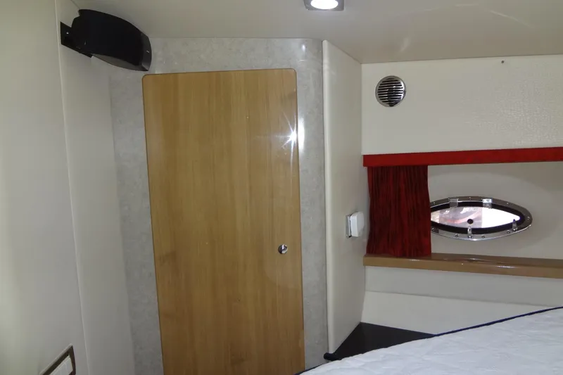 Dream Catcher Yacht Photos Pics Interior of 2010 Formula 45 Yacht with wooden door and porthole window.