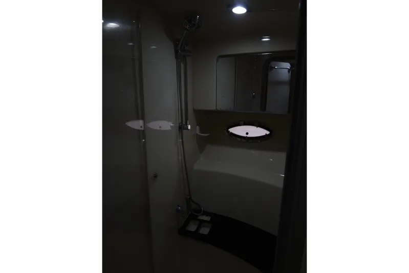 Dream Catcher Yacht Photos Pics Interior of 2010 Formula 45 Yacht bathroom with shower and porthole window.