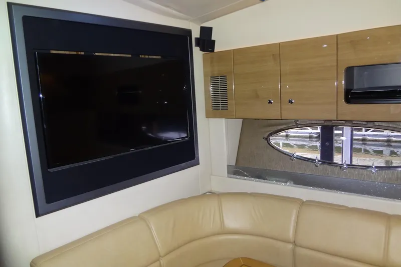 Dream Catcher Yacht Photos Pics Interior of 2010 Formula 45 Yacht with TV, cabinets, and leather seating.