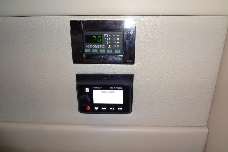Dream Catcher Yacht Photos Pics Control panels on 2010 Formula 45 Yacht, featuring Dometic and Fusion MS-NRX300 displays.