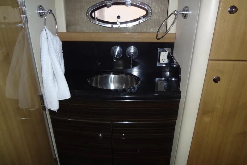 Dream Catcher Yacht Photos Pics 2010 Formula 45 Yacht bathroom sink with towel and porthole window.