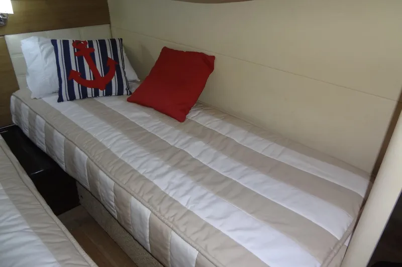 Dream Catcher Yacht Photos Pics Cozy cabin bed in 2010 Formula 45 Yacht with nautical-themed pillows.
