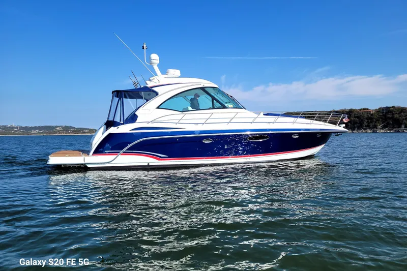 Dream Catcher Yacht Photos Pics 2010 Formula 45 Yacht cruising on a sunny day, blue water and clear sky backdrop.