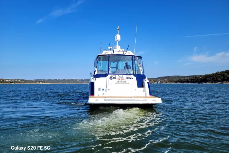 Dream Catcher Yacht Photos Pics 2010 Formula 45 Yacht on water, clear sky, for sale sign visible.