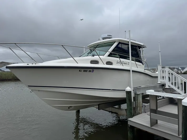  Yacht Photos Pics 2019 Boston Whaler 315 Conquest docked on a cloudy day.