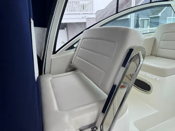  Yacht Photos Pics 2019 Boston Whaler 315 Conquest interior with white seating and modern design.
