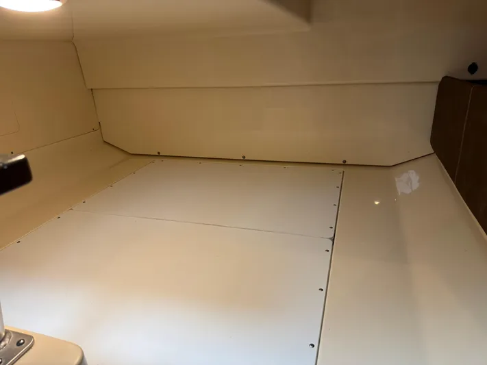  Yacht Photos Pics Interior cabin of 2019 Boston Whaler 315 Conquest, featuring sleek, minimalist design.