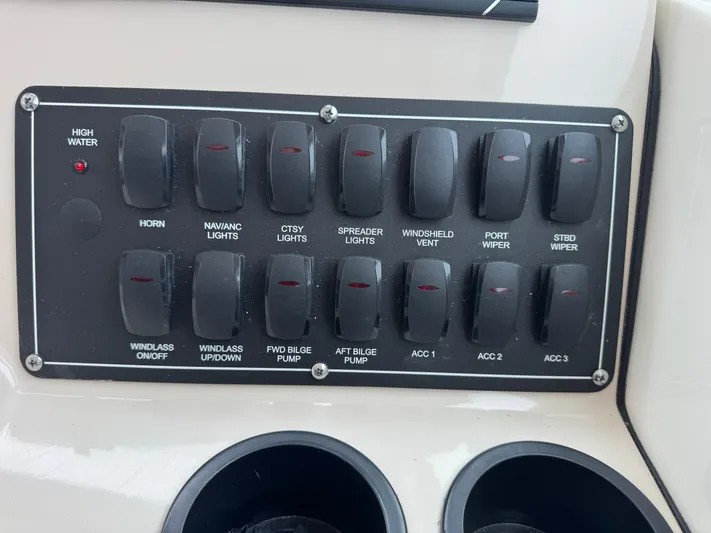  Yacht Photos Pics Control panel of a 2019 Boston Whaler 315 Conquest boat with labeled switches.